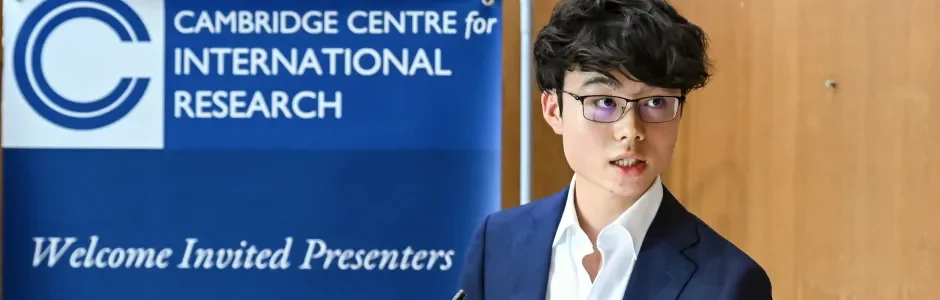 Student presenter speaking at the Cambridge Centre for International Research (CCIR) Symposium at King's College, University of Cambridge.